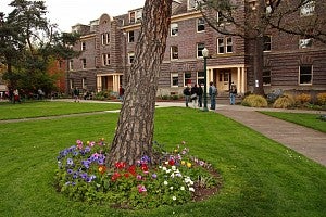 Students walk by Friendly Hall on UO campus. 