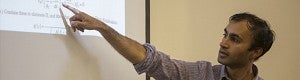 Teacher pointing to projected screen