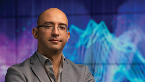 Ramón Alvarado Assistant, Professor of Philosophy and Data Science Initiative in front of data.