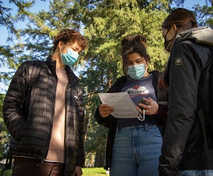 students outside with gps device