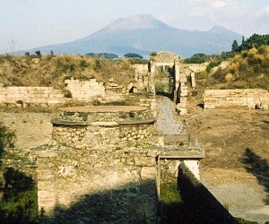 porta di stabia neighborhood in pompeii with mount vesuvius in background