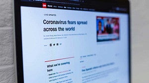 Laptop with CNN article about insight into the new coronavirus and the COVID-19 illness.