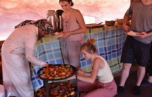 students at mealtime with bedouin hosts