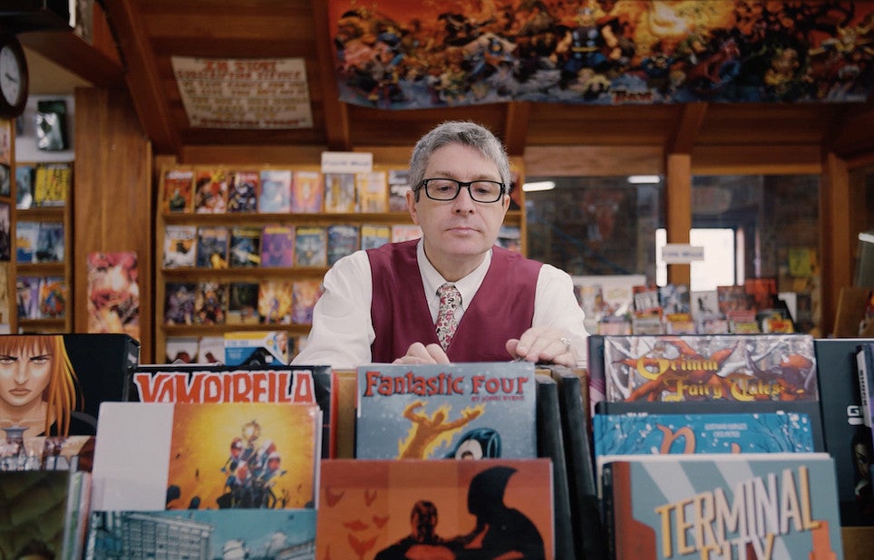 professor Ben Saunders browsing comic books in a store