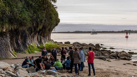 Students have bonfire on the beach