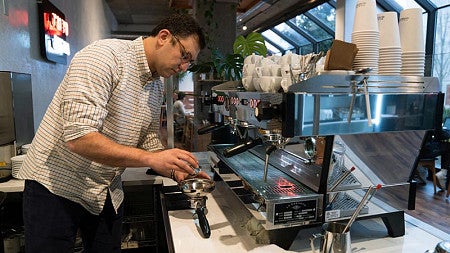 Christopher Hendon prepares an espresso shot at Tailored Coffee Roasters in Eugene.