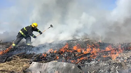 A wildland firefighter fighting a blaze