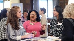 Women discussing subject at a conference