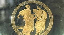 man and woman robed figures in 2d stone art