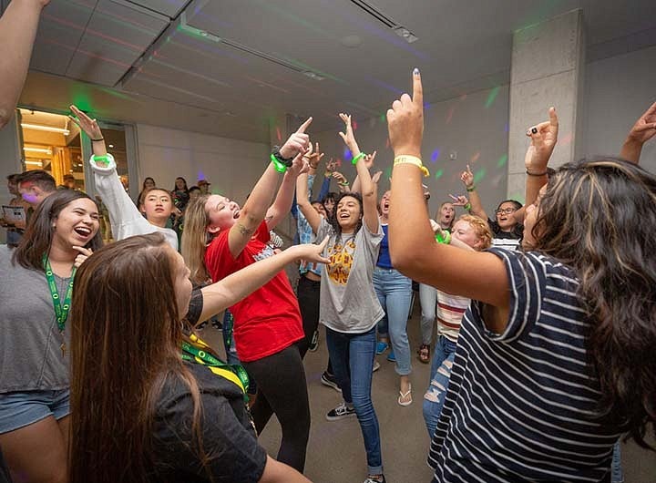 students cheering during gathering