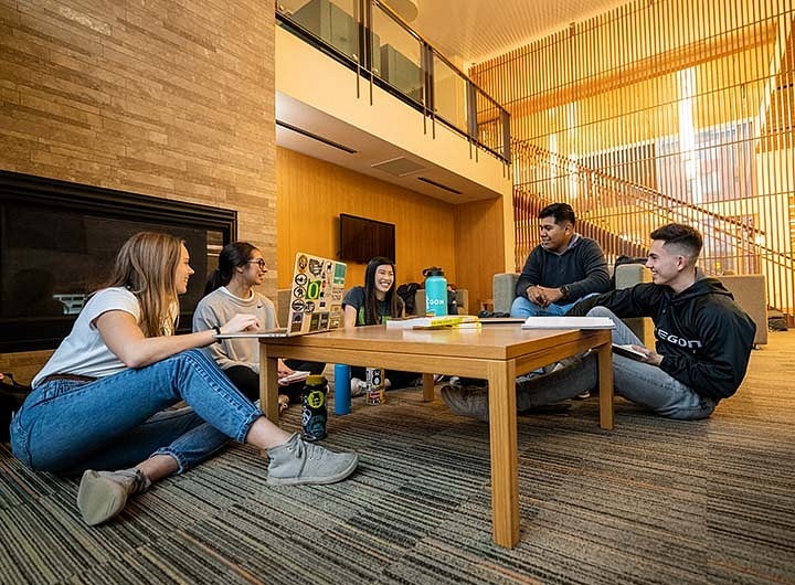 students sitting around a table talking