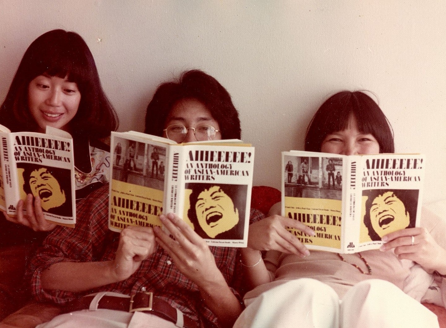 people reading book on asian-american literature