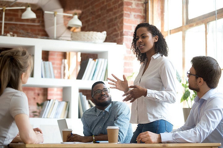 A black lady leading a meeting