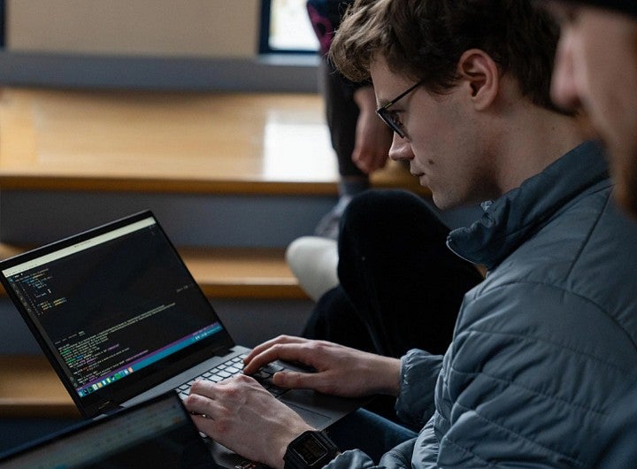 A man types on a computer