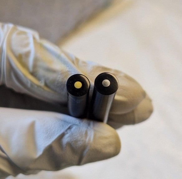 A student holding batteries 