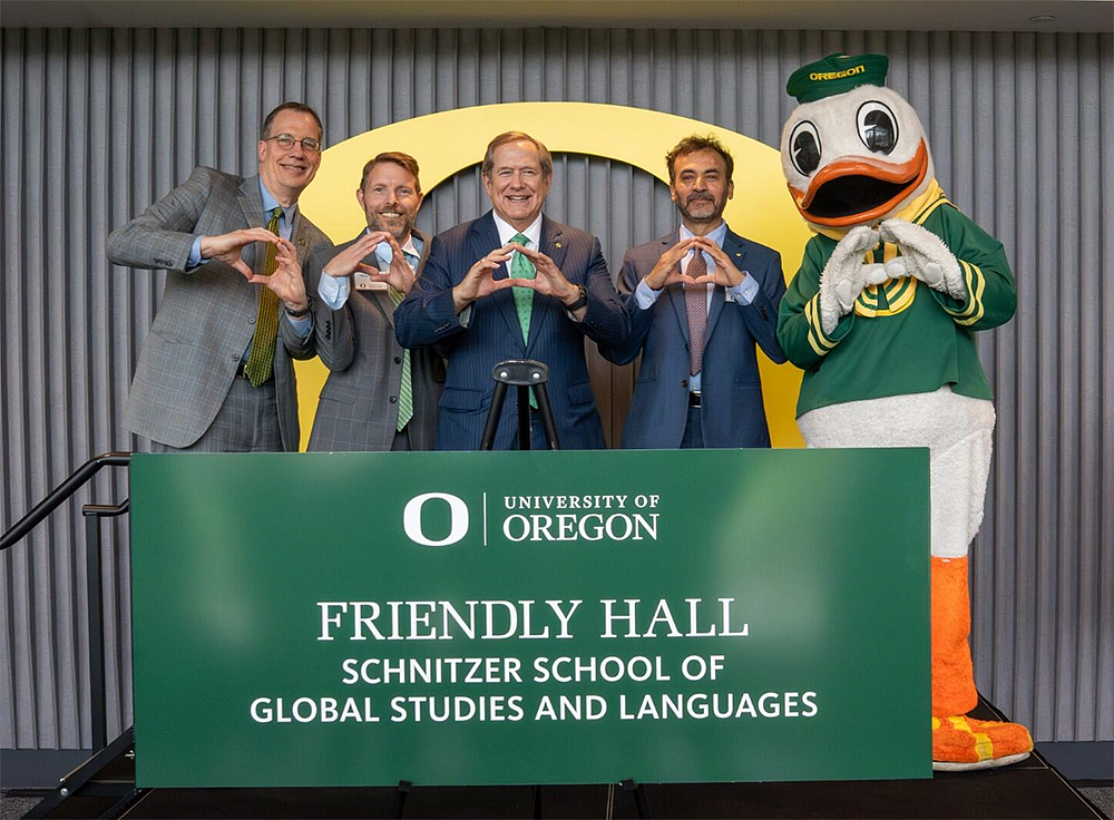 UO leadership and Jordan Schnitzer posing on podium