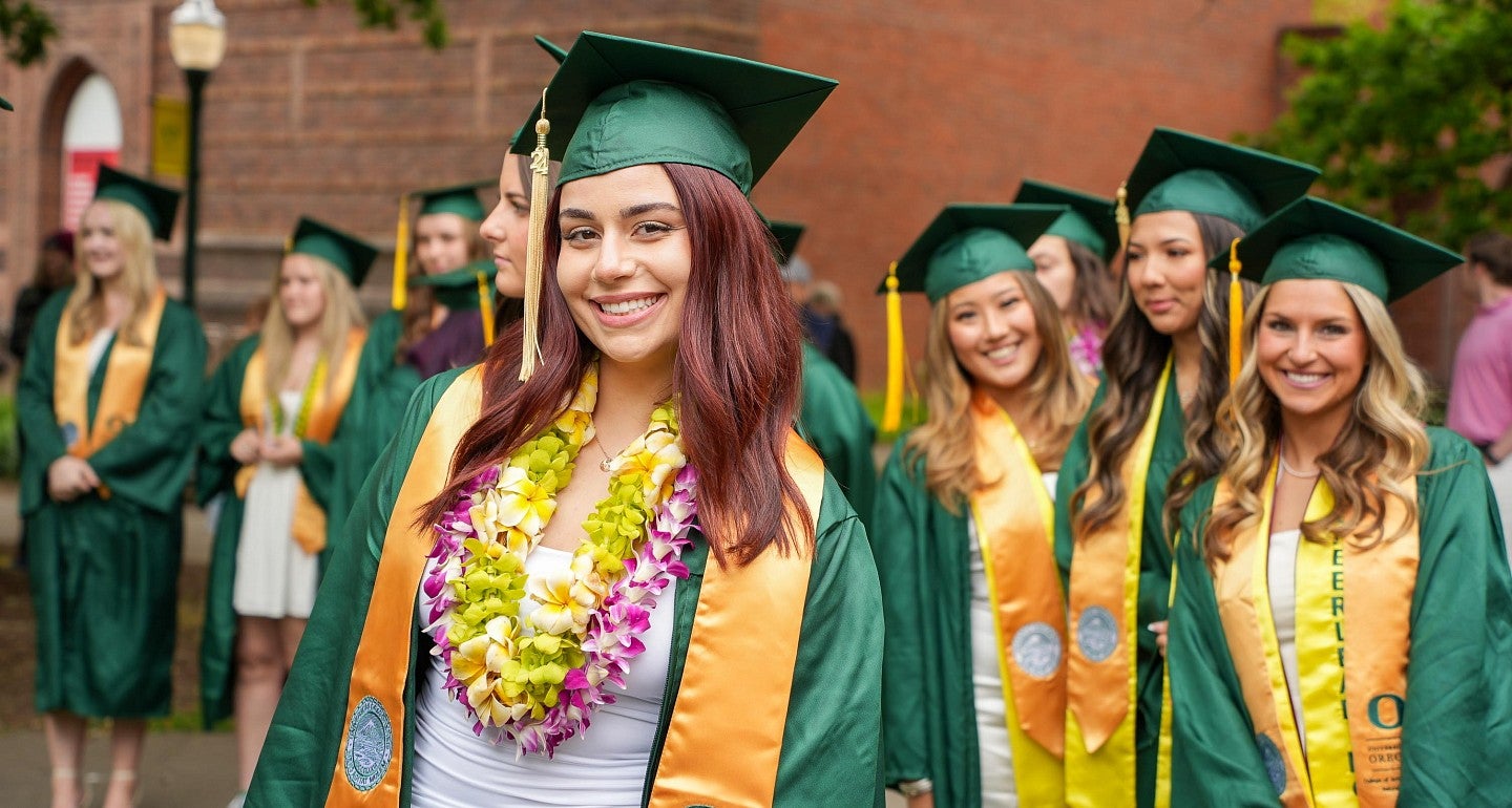 a group of people in line for graduation