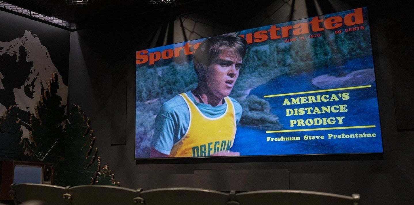 a tv screen featuring prefontaine as a child on sports illustrated