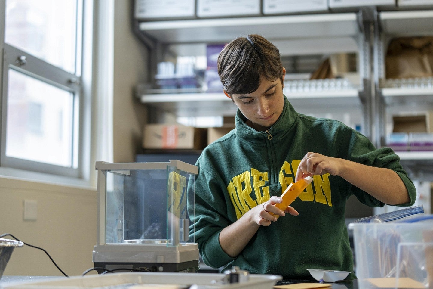 a person in a lab using seeds