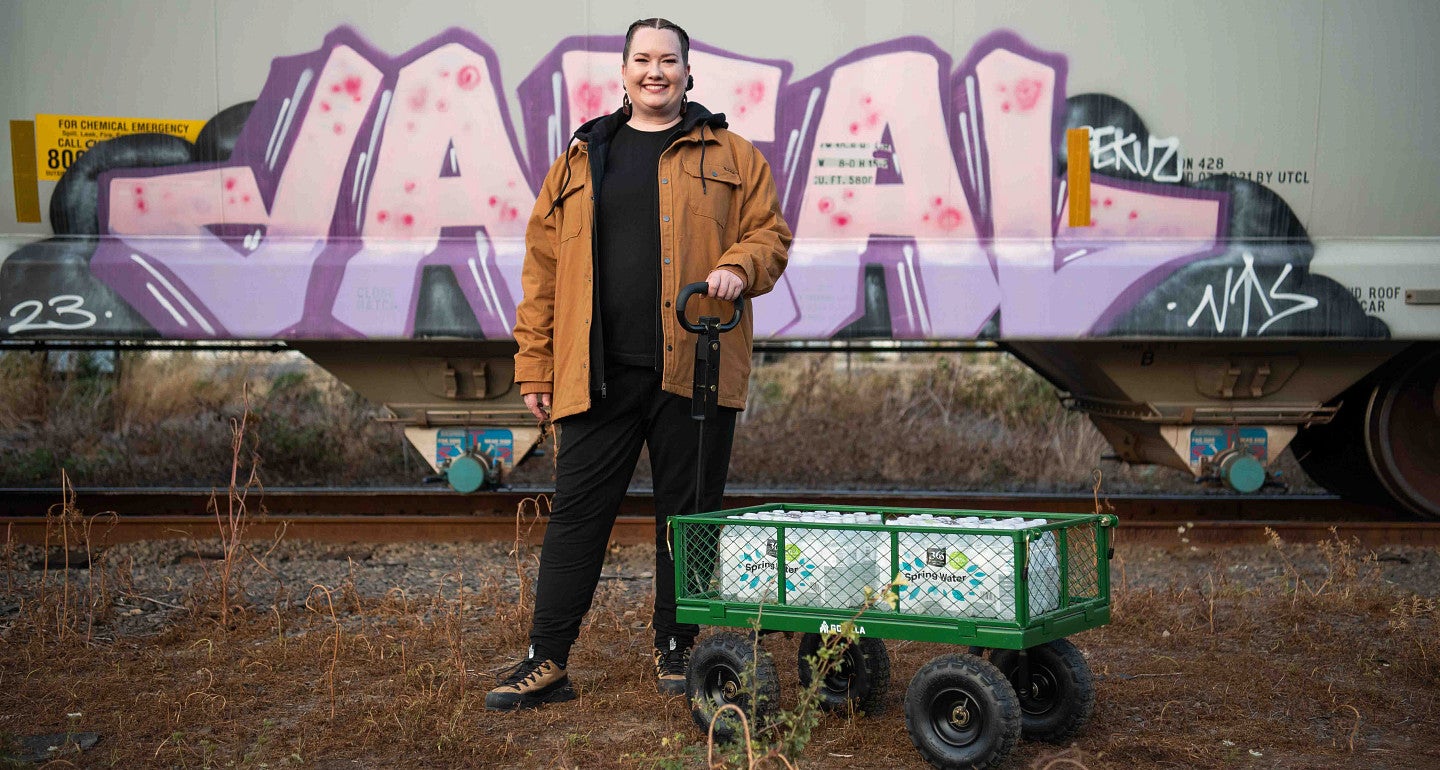 a person standing next to a wagon
