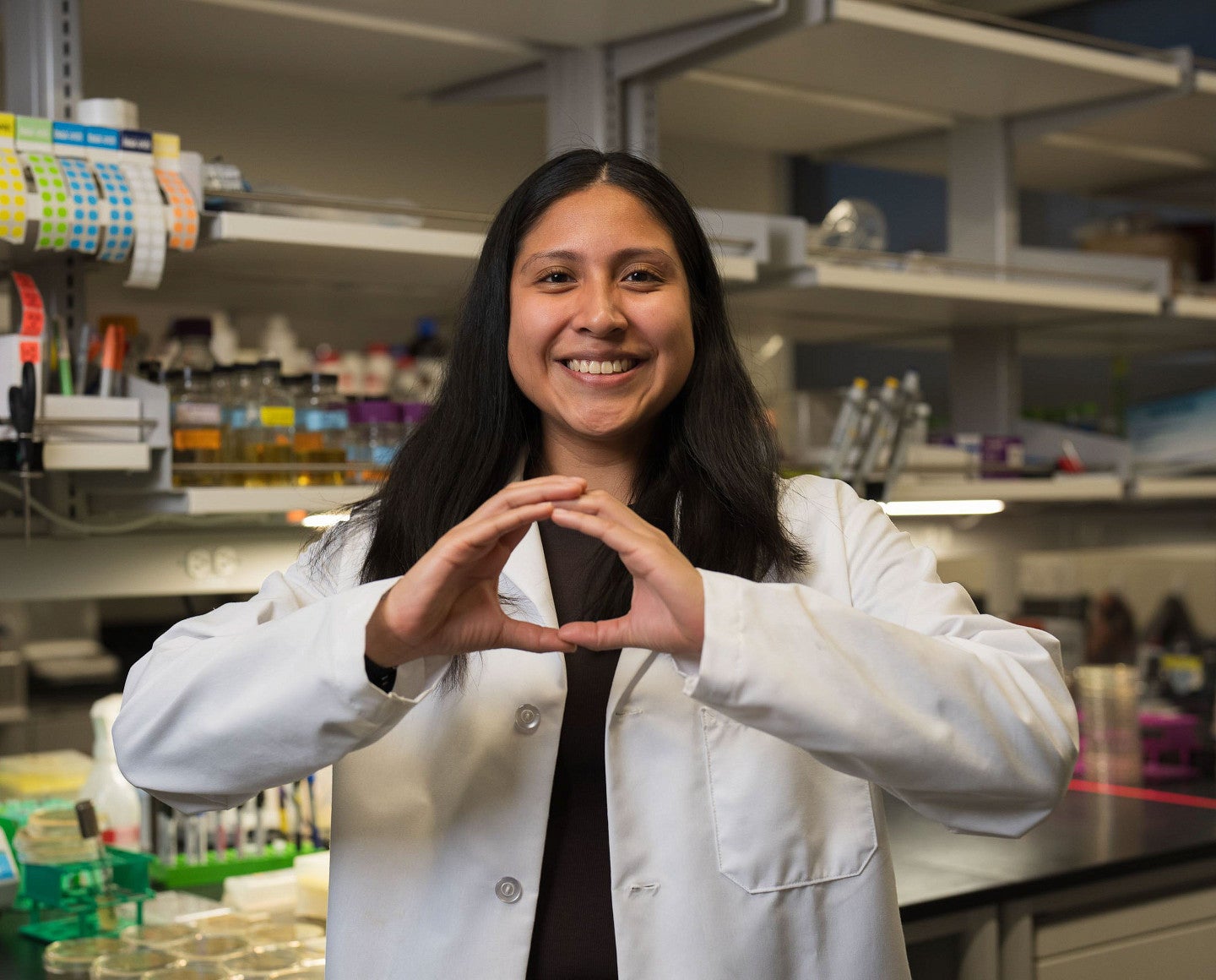 a person throwing the "O" 