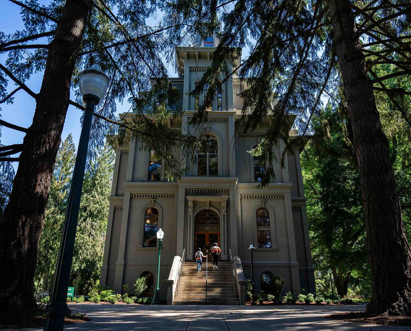 exterior of Villard Hall on campus surrounded by trees