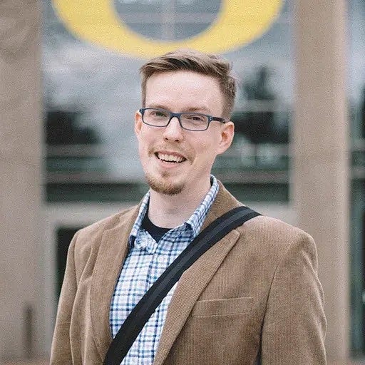 a person stands in front of the Oregon O