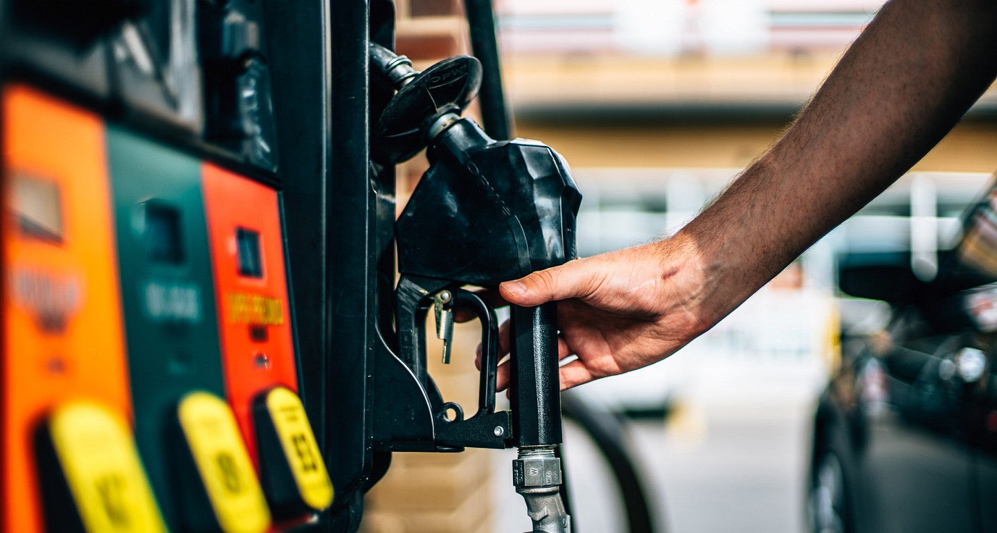 a person at the gas pump