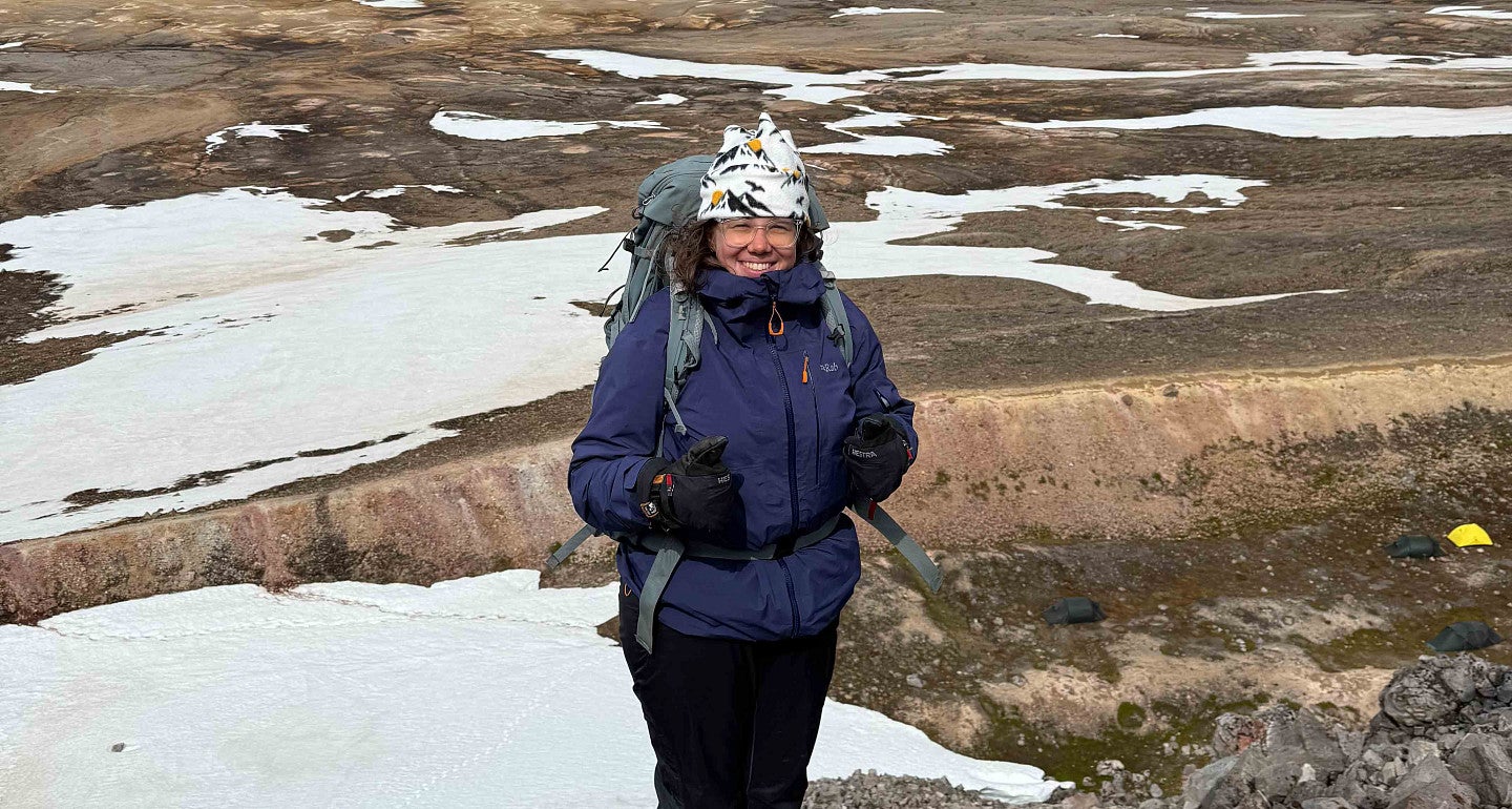 a person wearing a jacket and beanie in a cold environment