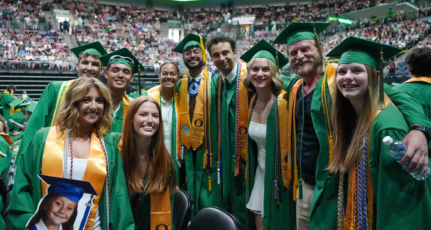 a group shot of people in graduate regalia