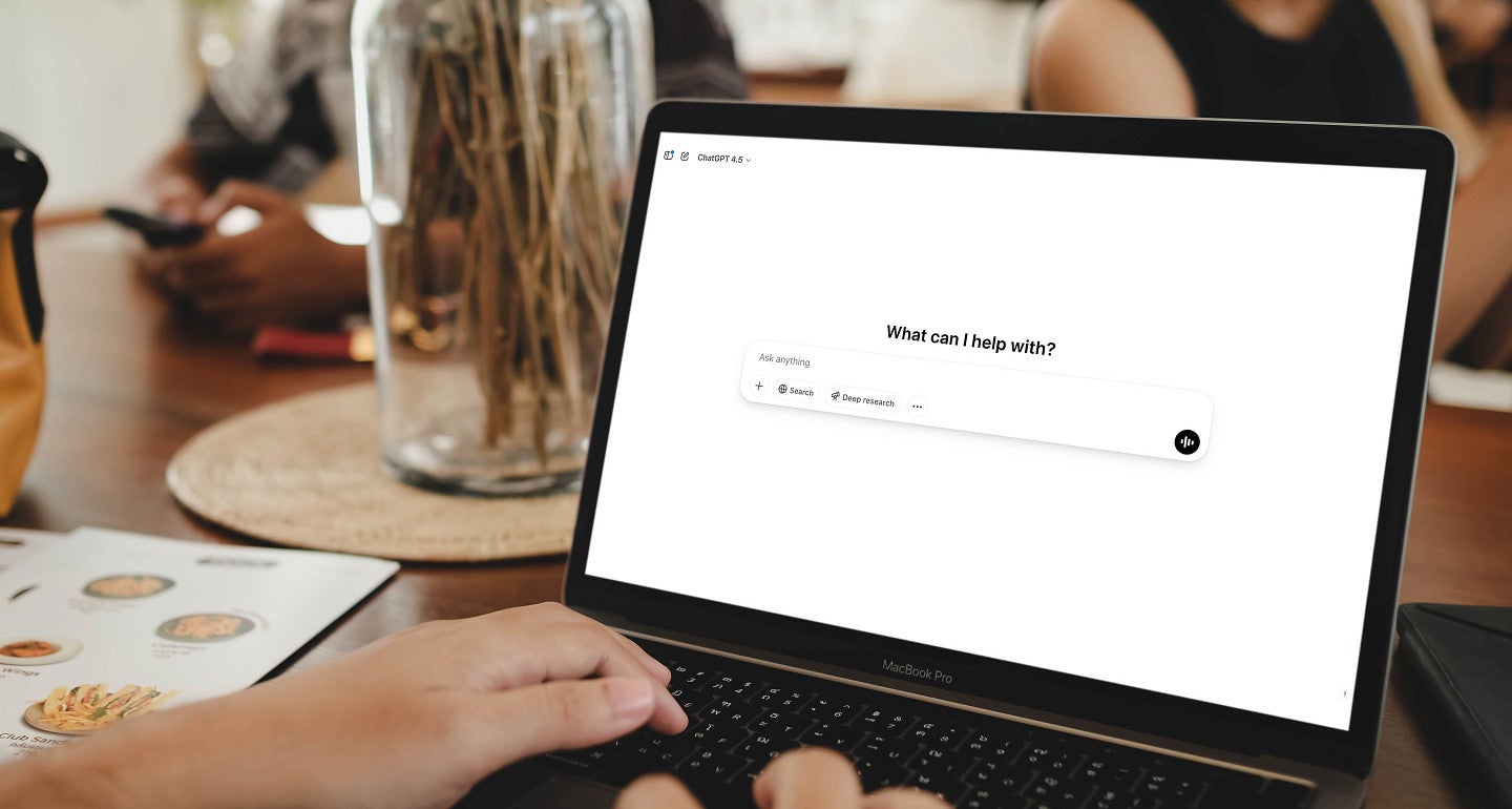 a person at a computer with an AI prompt