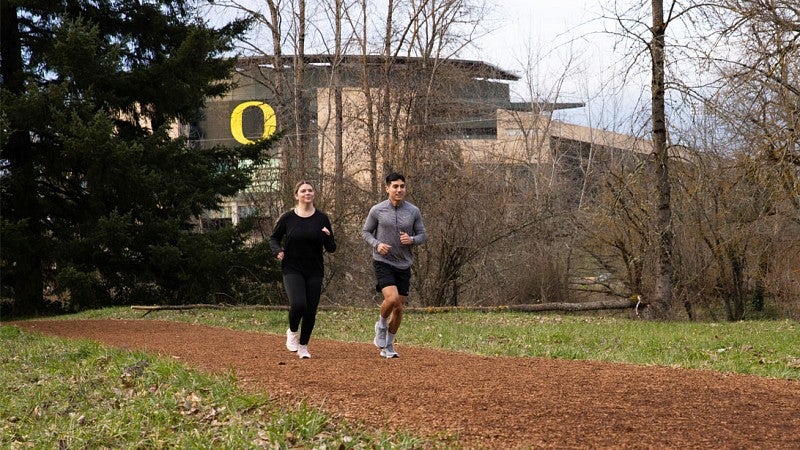 Students running on trail