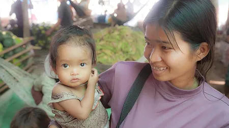 cambodian mother holding infant