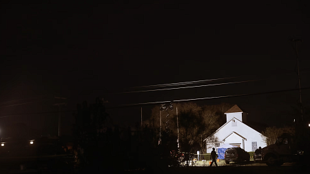 lights flash on a house at night