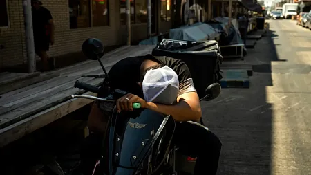 a person sleeps from heat exhaustion on a bike