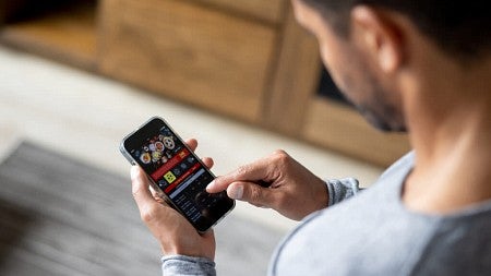 a person using a smart phone to bet on sports