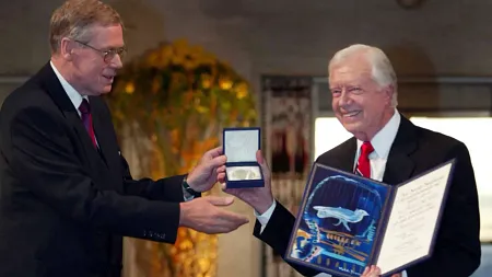 former President Jimmy Carter on the right receives the Nobel Peace Prize 