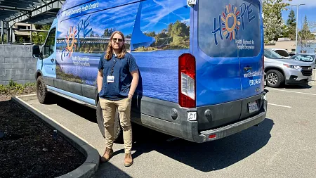 a person standing by a van