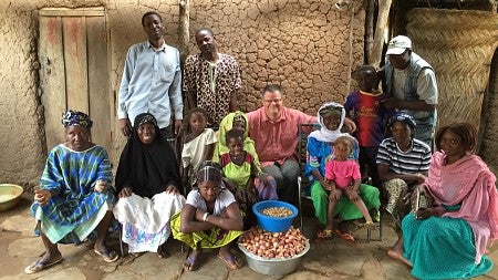 Stephen Wooten poses with a family in Mali