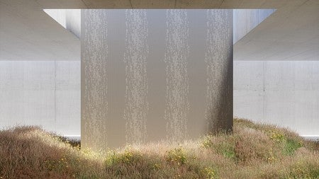 grass growing around a concrete pillar