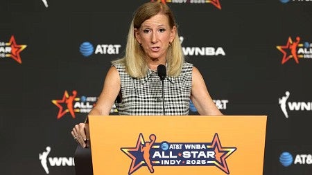 a woman presenting at a conference