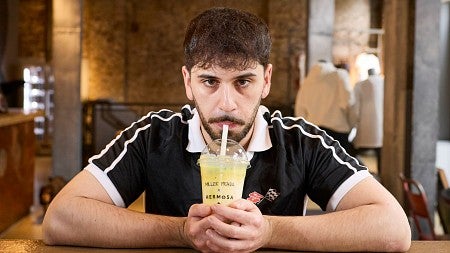 a man drinking a protein shake