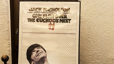 a movie poster on a wall