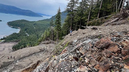 a rock outcrop in Alaska with a lake 