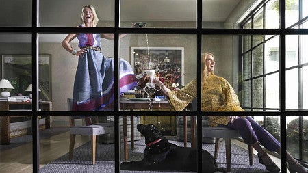 two women pour champagne 