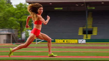 a person running on the old hayward field