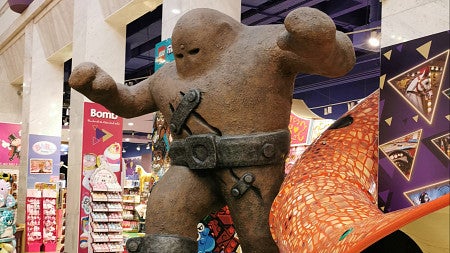 a figure of a golem in a toy store setting