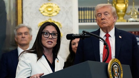 Lori Chavez-DeRemer speaks at the White House with President Donald Trump behind her