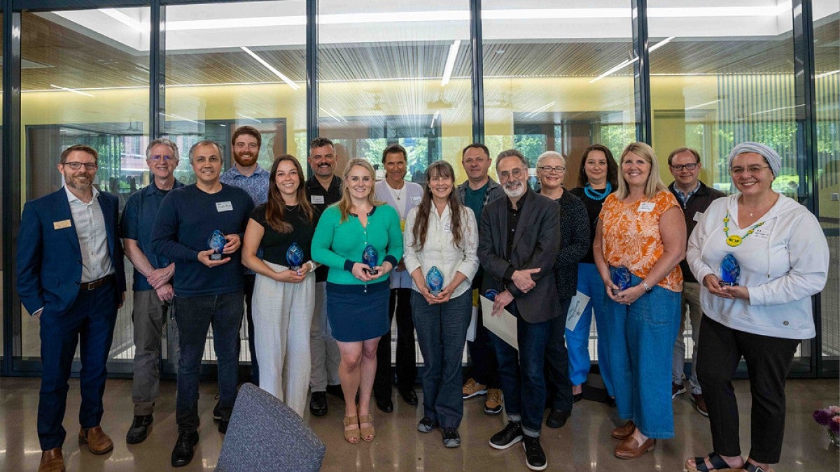 Group of CAS award winners posing together 