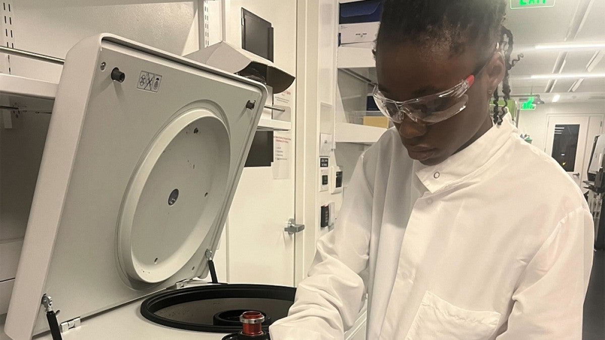 Student wearing safety glasses working in a lab